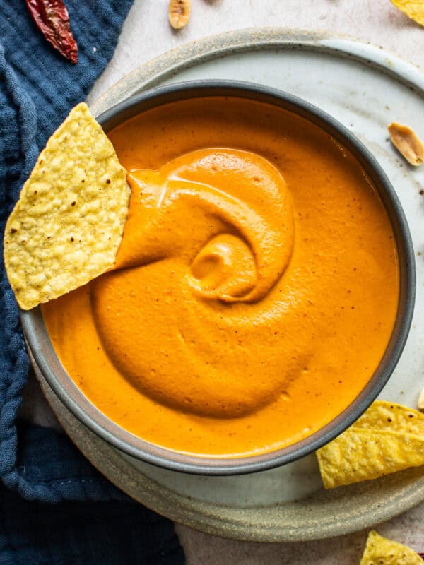 Salsa de cacahuate in a bowl with a tortilla chip.
